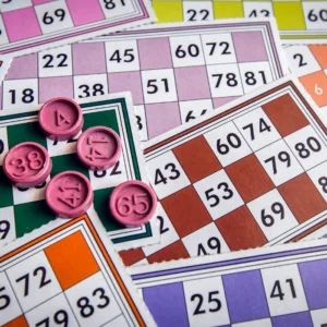 Colorful bingo cards with numbers ready for a family game of Family Candy Bingo.