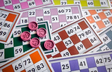 Colorful bingo cards with numbers ready for a family game of Family Candy Bingo.