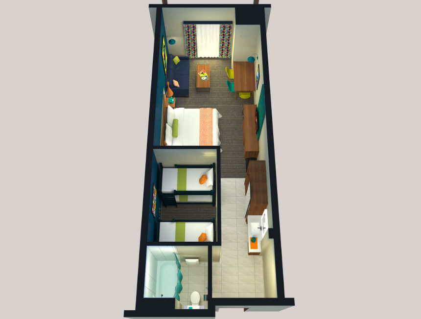 Top-down view of a compact hotel room with a double bed, two single beds, desks, wardrobes, and an ensuite bathroom.